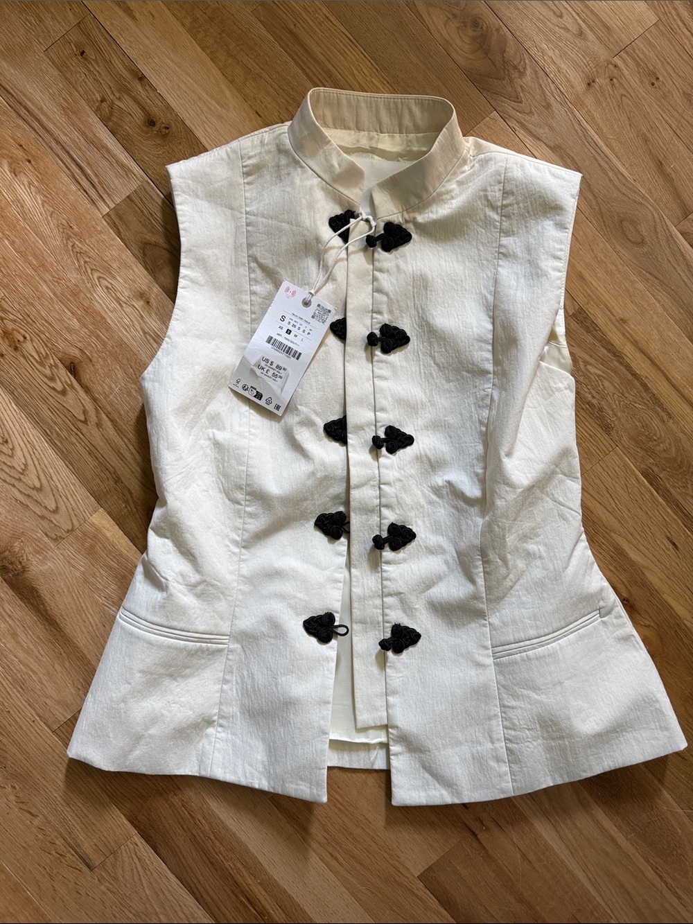 Women’s Ivory Sleeveless Mandarin Vest with Black Frog Closures